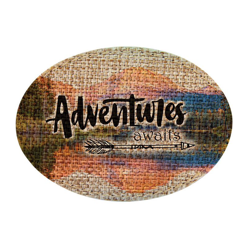 Parche ovalado sublimable de arpillera de 3 1/2' x 2 1/2' con adhesivo