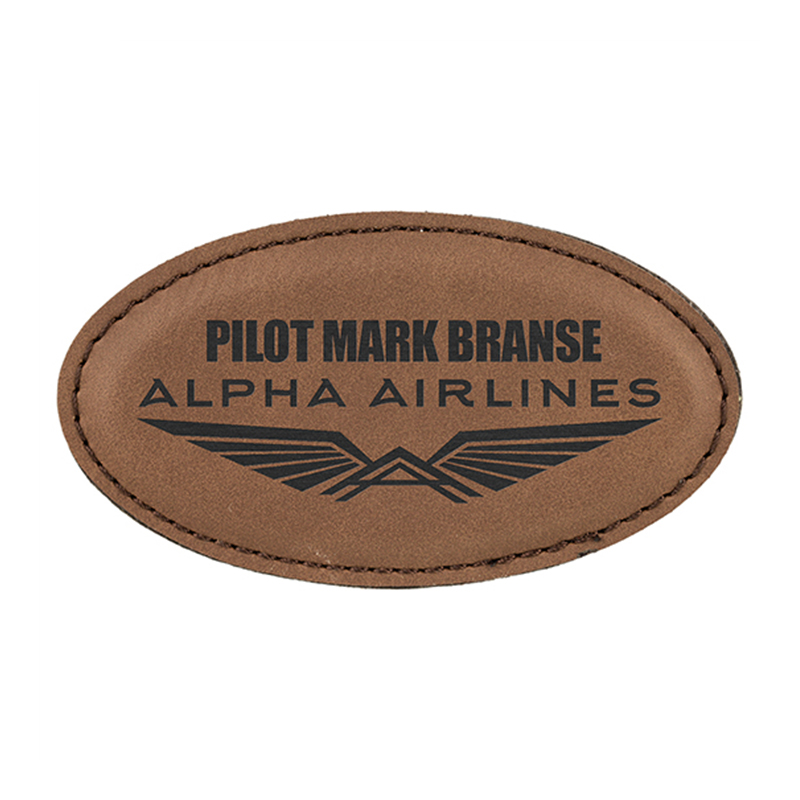 Manta ovalada con insignia de polipiel laserable y imán Manta ovalada con insignia de polipiel laserable y imán